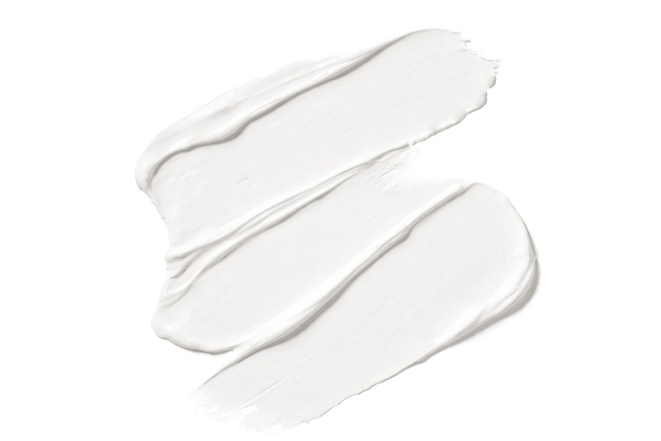 Trois coups de crème blanche sur fond blanc